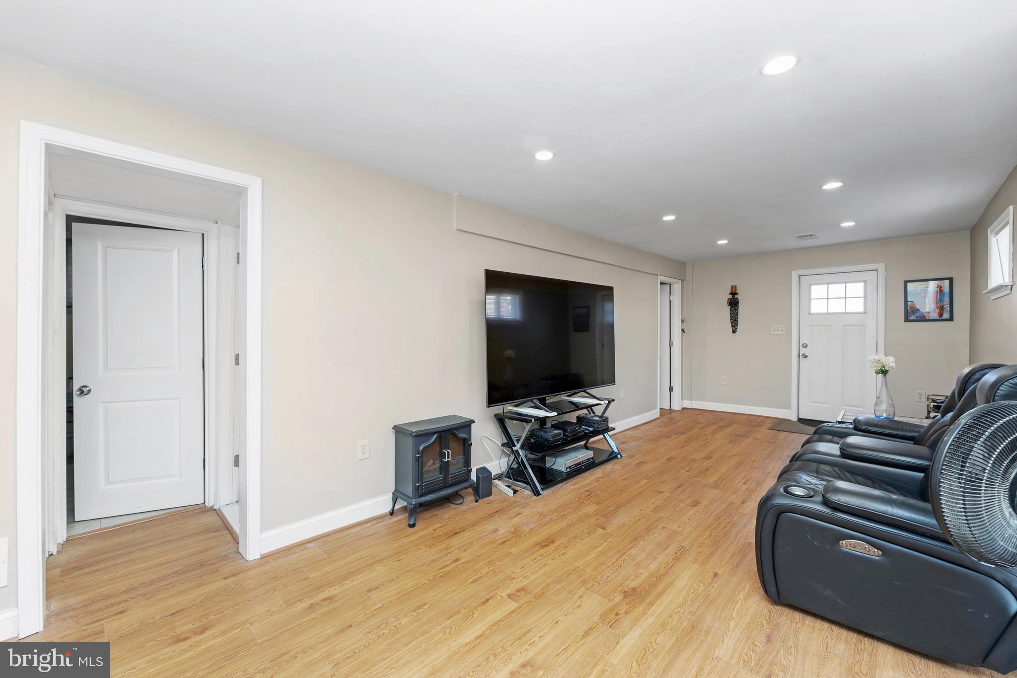 123 Walnut Street Northwest Washington, DC 20012 - Photo 31 of 59 a view of a livingroom with furniture and a flat screen tv