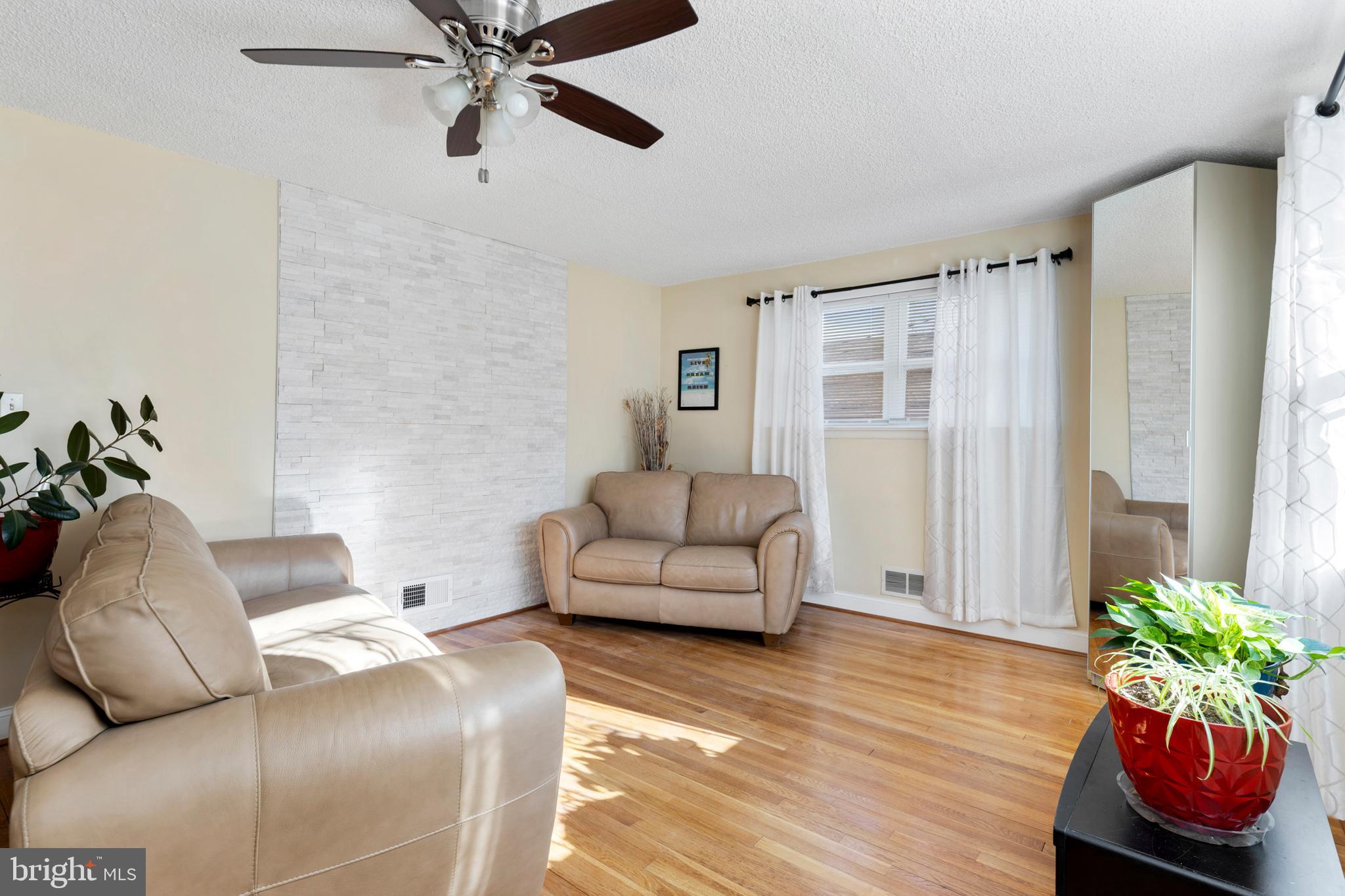 123 Walnut Street Northwest Washington, DC 20012 - Photo 6 of 59 a living room with furniture and a wooden floor