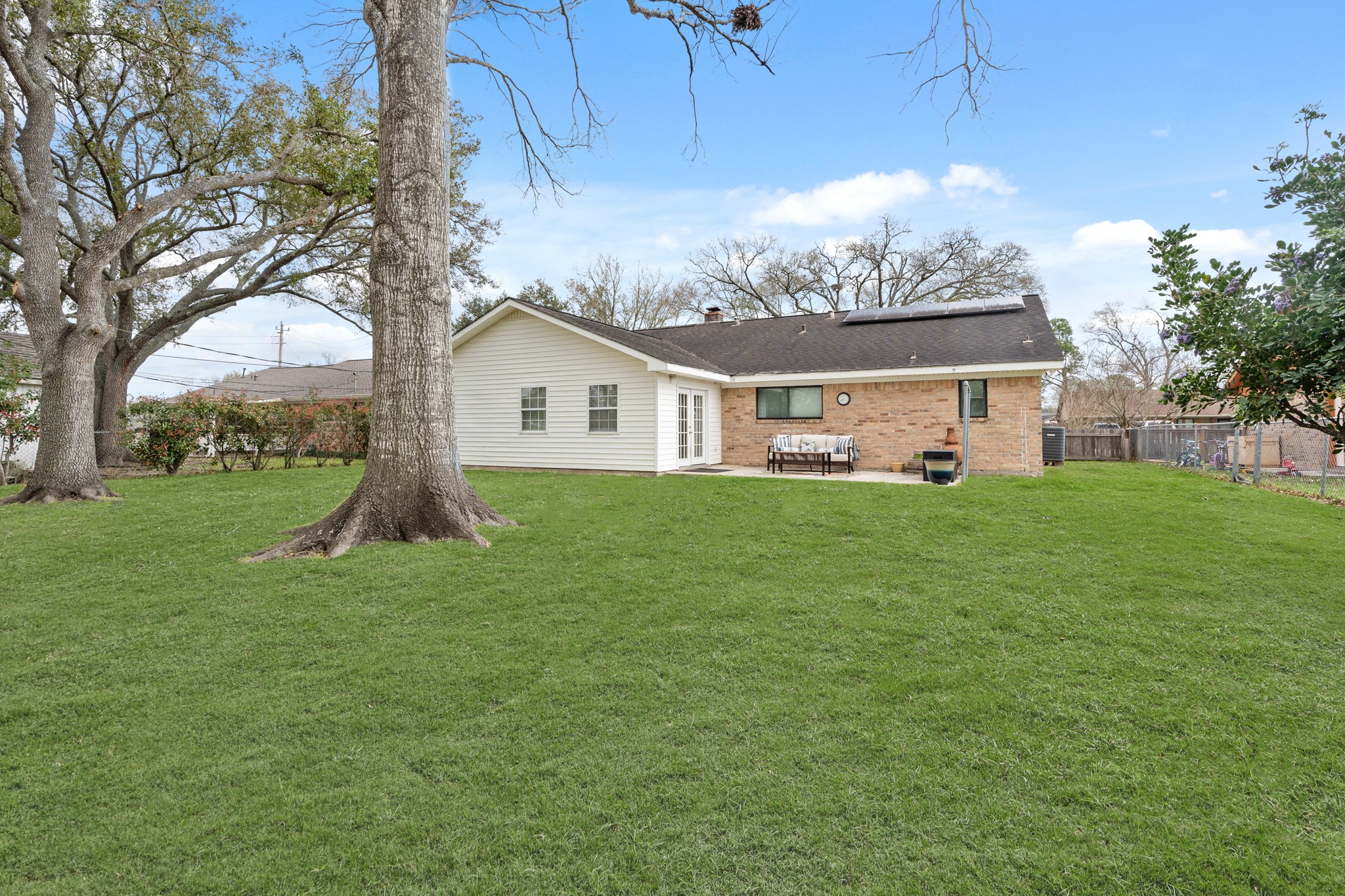 2104 Rose Road Pearland, TX 77581 - Photo 42 of 43 a front view of a house with a yard