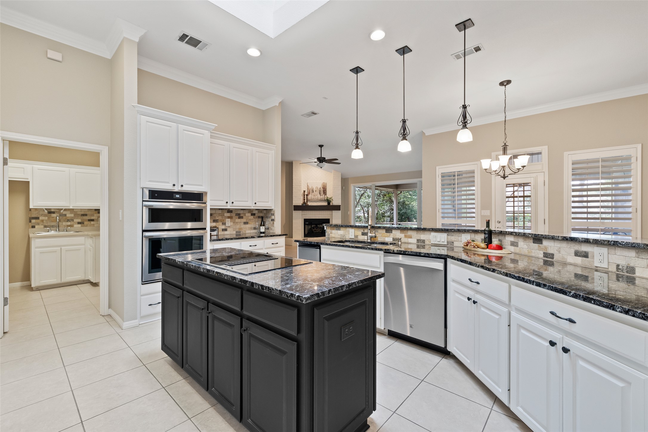 The kitchen was updated with stainless Jenn Air oven, built in oven & microwave...Dishwasher & built in ice-making machine...