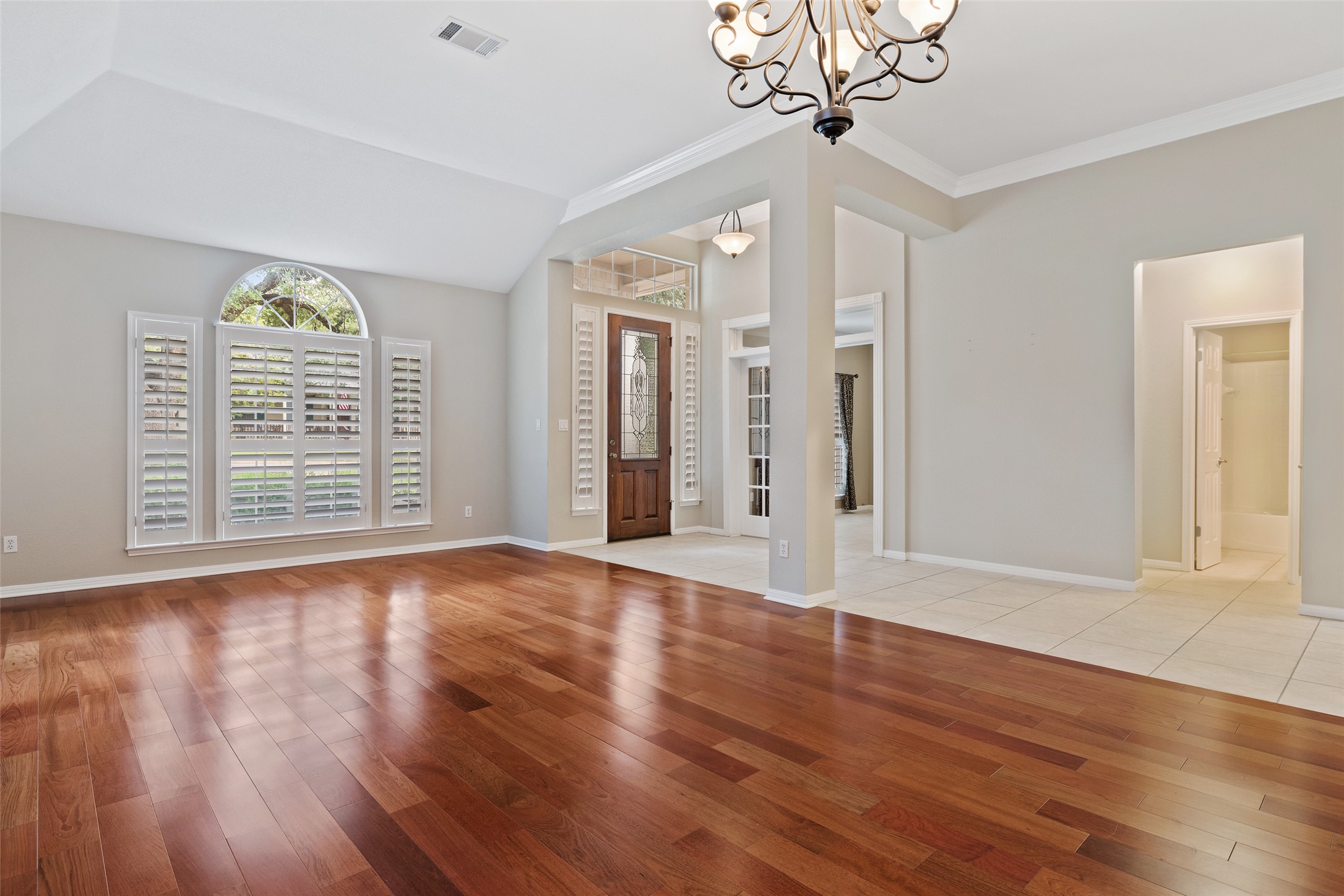 31000 Clearwater Court Georgetown, TX 78628 - Photo 11 of 39 a view of an empty room with wooden floor and a window