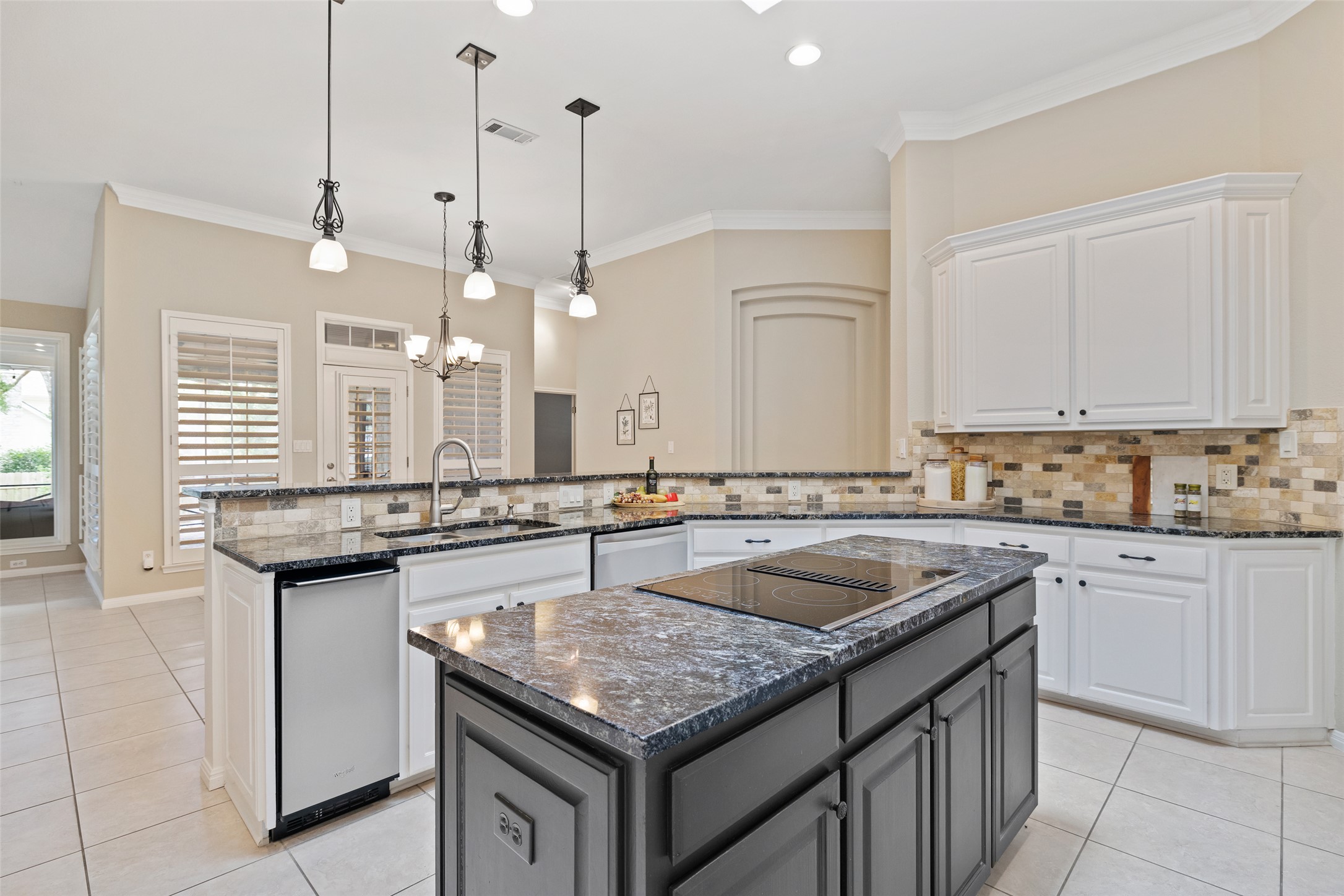31000 Clearwater Court Georgetown, TX 78628 - Photo 16 of 39 a kitchen with granite countertop a sink a counter space appliances and cabinets