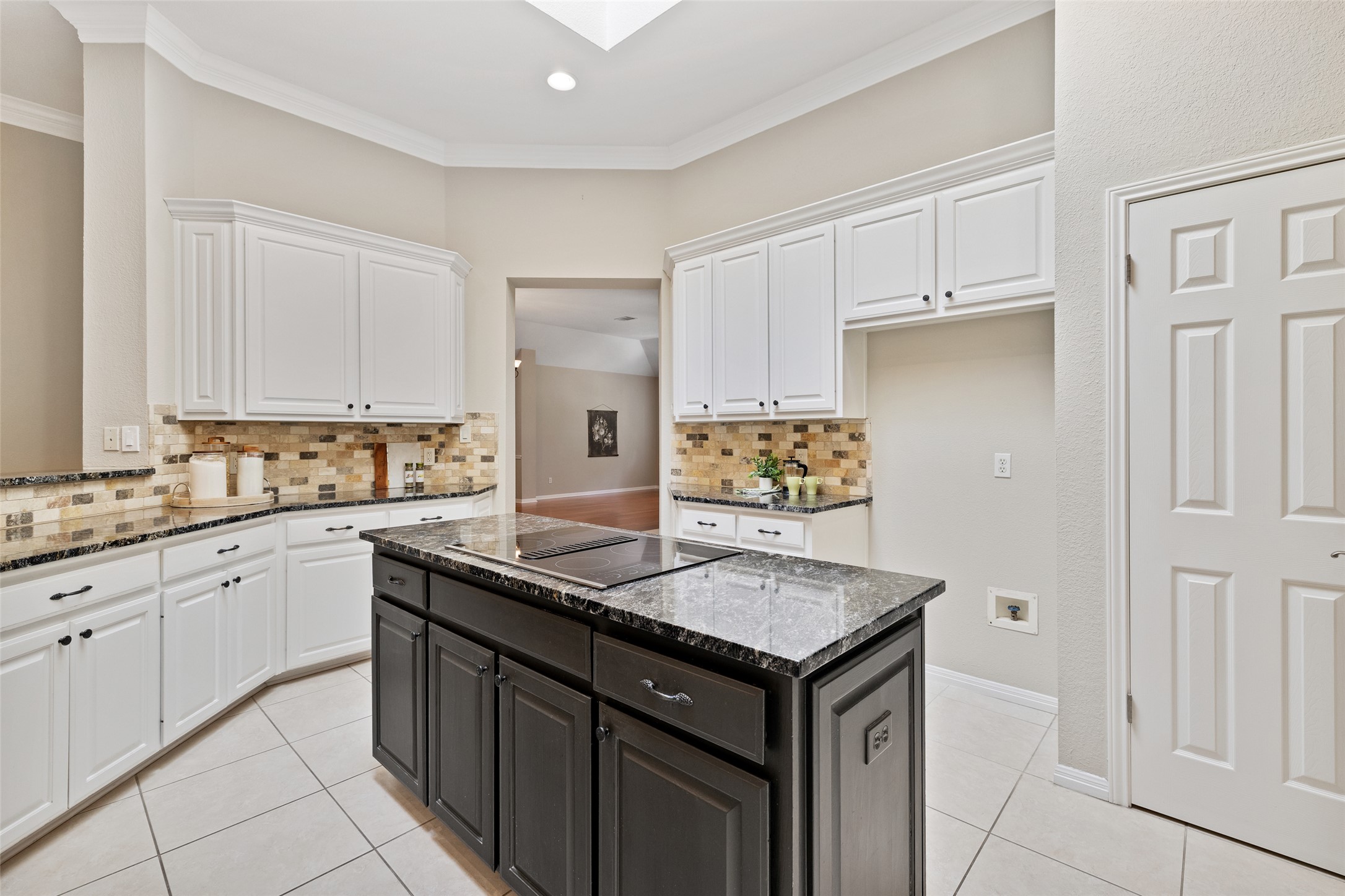 31000 Clearwater Court Georgetown, TX 78628 - Photo 18 of 39 a kitchen with stainless steel appliances granite countertop a sink and dishwasher with white cabinets