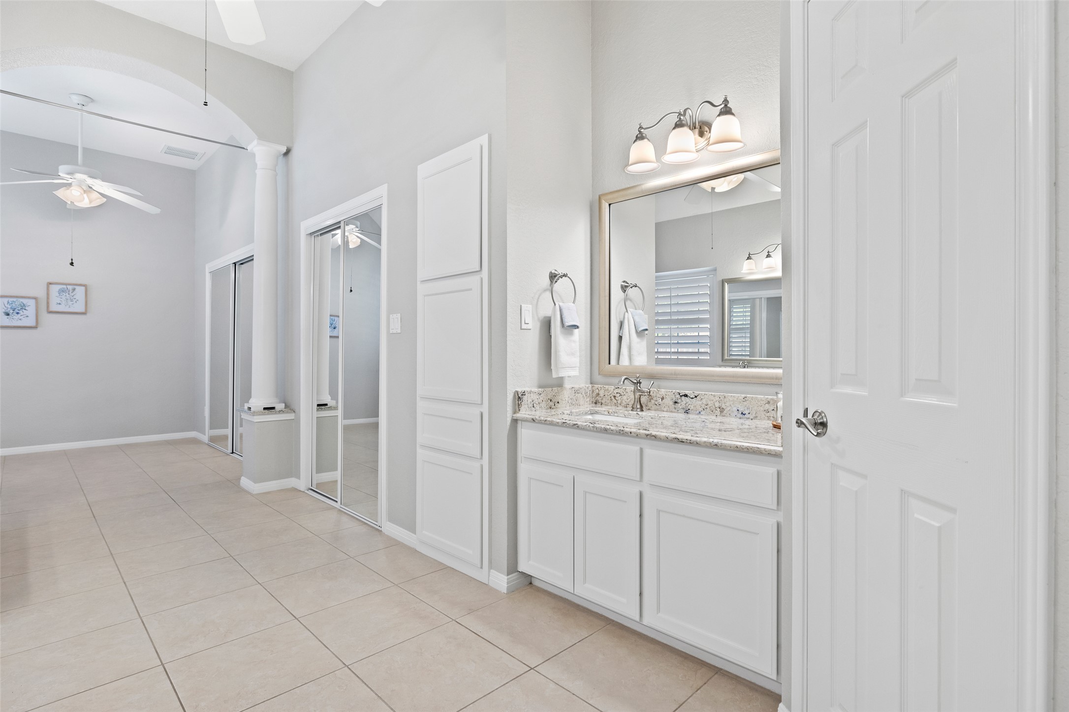 31000 Clearwater Court Georgetown, TX 78628 - Photo 32 of 39 a bathroom with a double vanity sink and a mirror