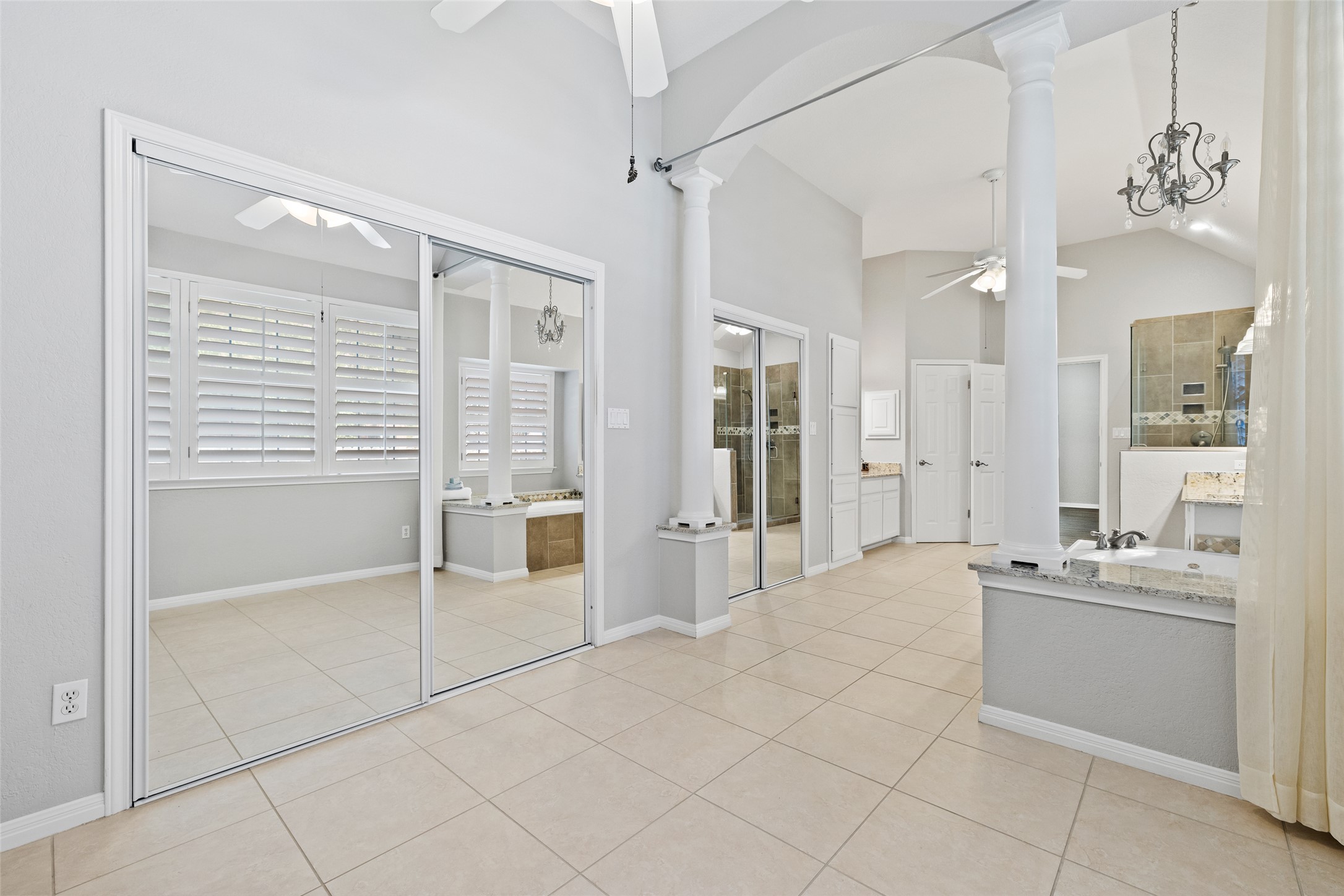 31000 Clearwater Court Georgetown, TX 78628 - Photo 34 of 39 From the flex space looking back toward the rest of the primary bathroom...Om the left, two walk-in closets with mirrored doors...