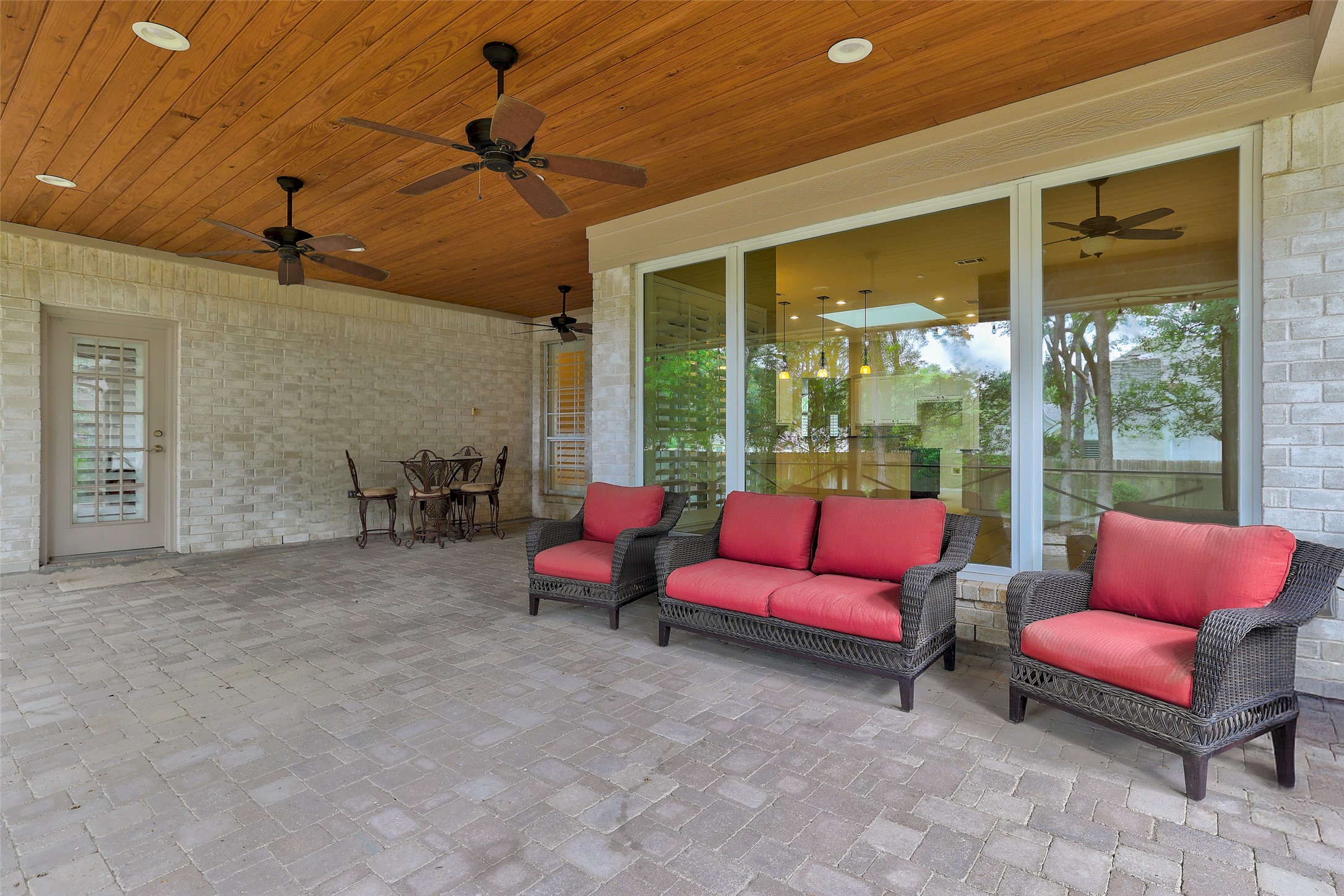 31000 Clearwater Court Georgetown, TX 78628 - Photo 38 of 39 Second photo of the very nice, covered rear patio which was professionally extended, wood ceiling added, paver flooring. Room for dining AND entertaining...