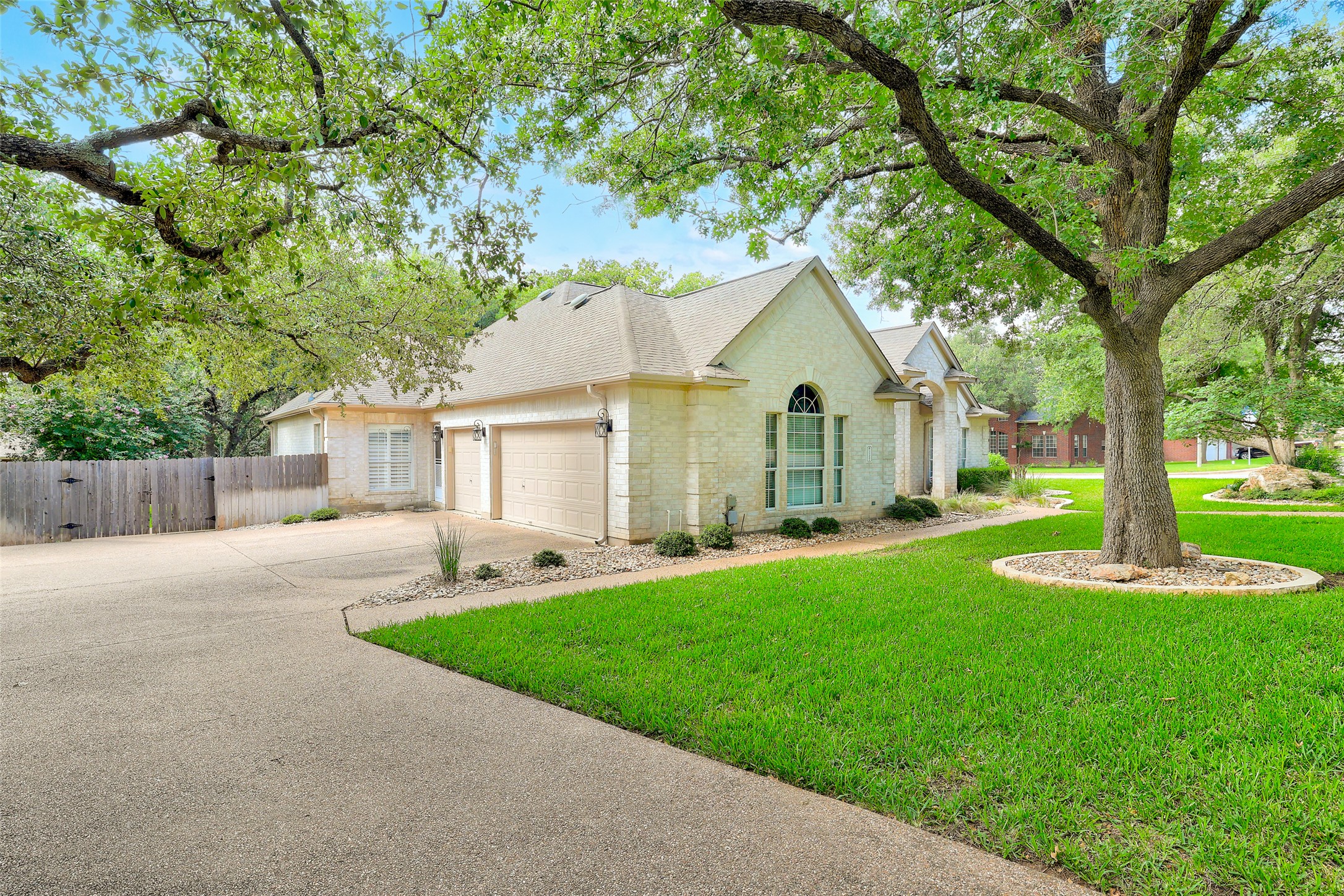 31000 Clearwater Court Georgetown, TX 78628 - Photo 4 of 39 a front view of a house with a yard and trees