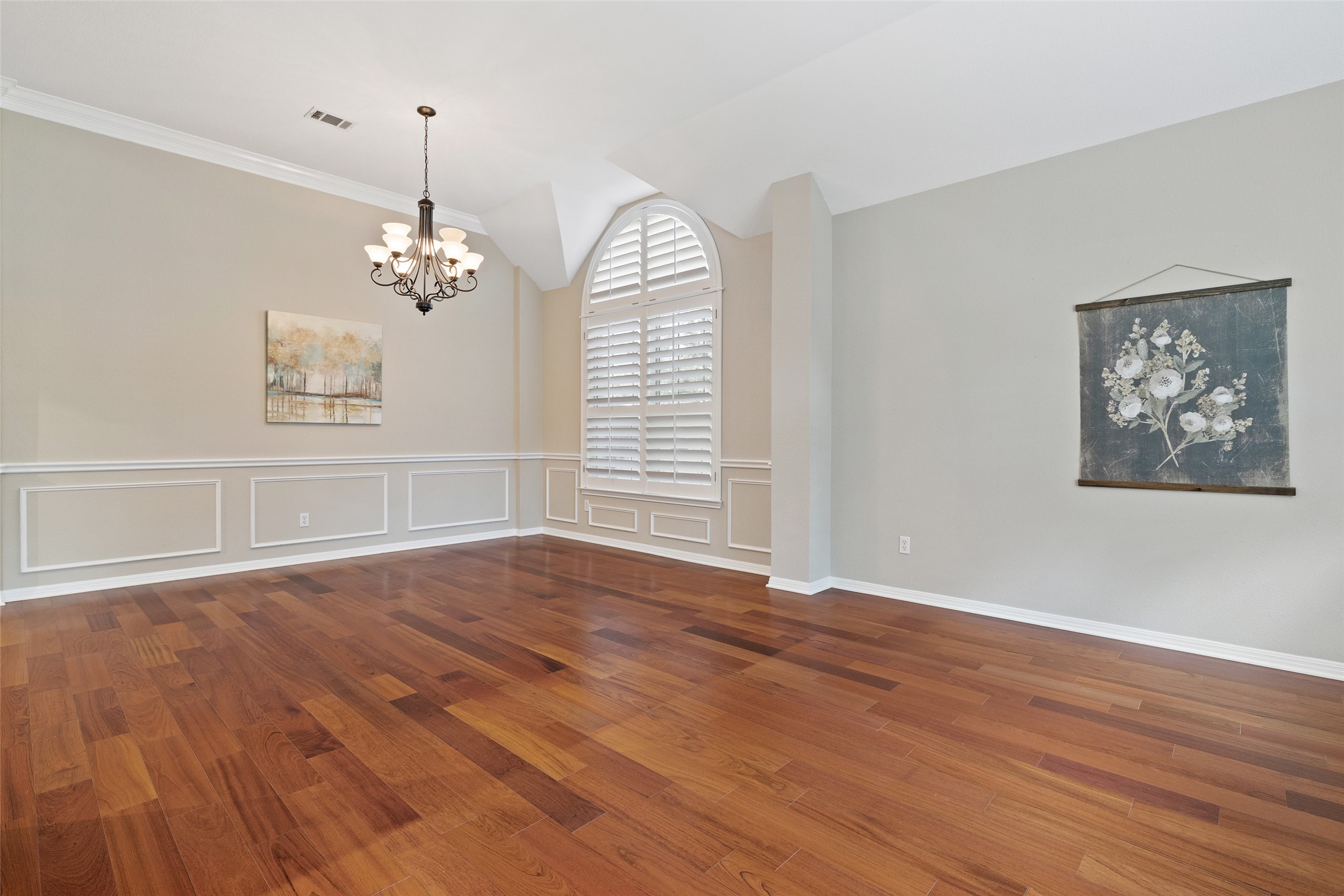 31000 Clearwater Court Georgetown, TX 78628 - Photo 9 of 39 an empty room with wooden floor chandelier and windows