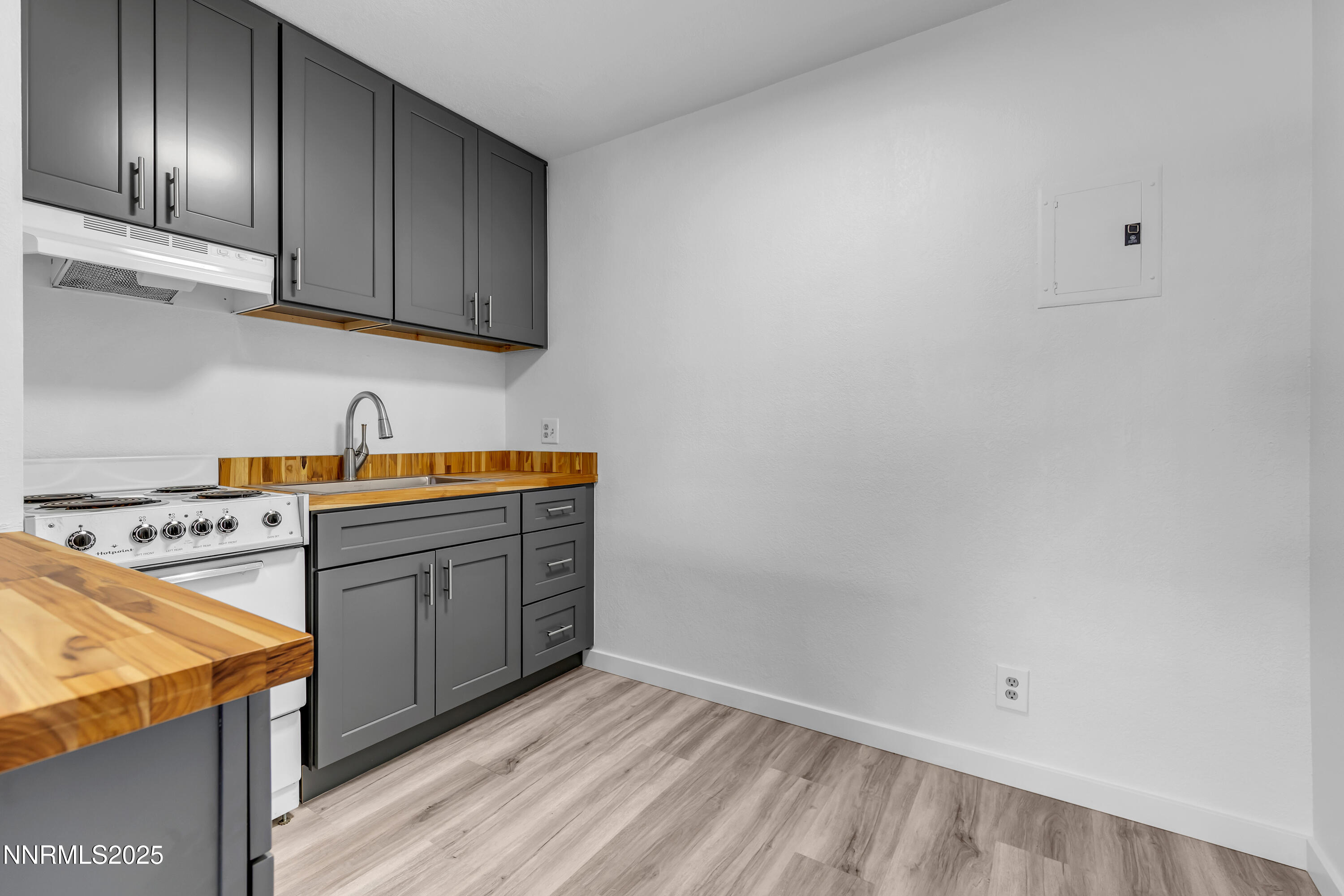 2450 Lymbery Street, Unit 331 Reno, NV 89509 - Photo 8 of 28 a kitchen with stainless steel appliances granite countertop a sink stove and cabinets
