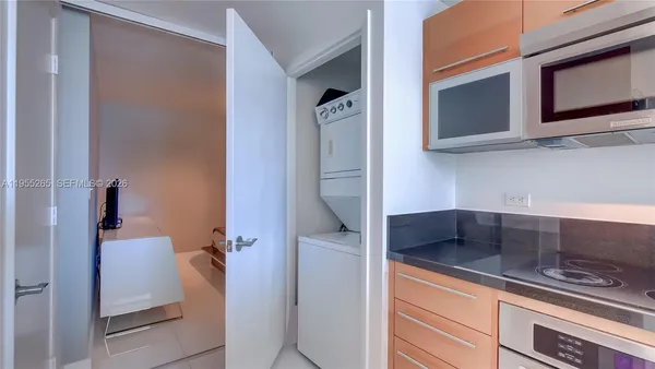 a kitchen with a refrigerator and a sink