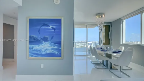 a dining room with furniture and window