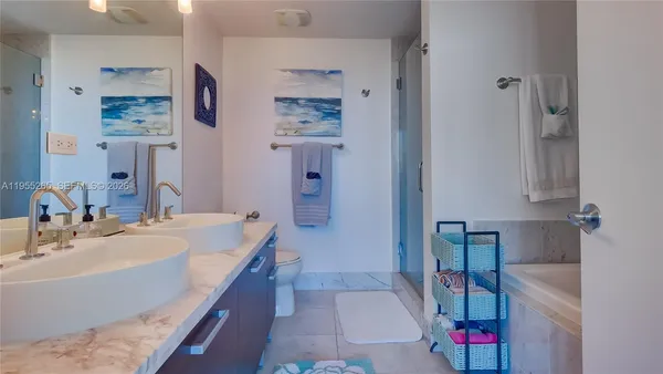 a bathroom with a tub sink and a mirror