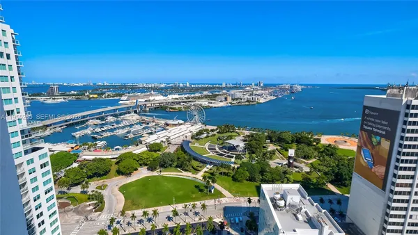 an aerial view of a residential houses with outdoor space