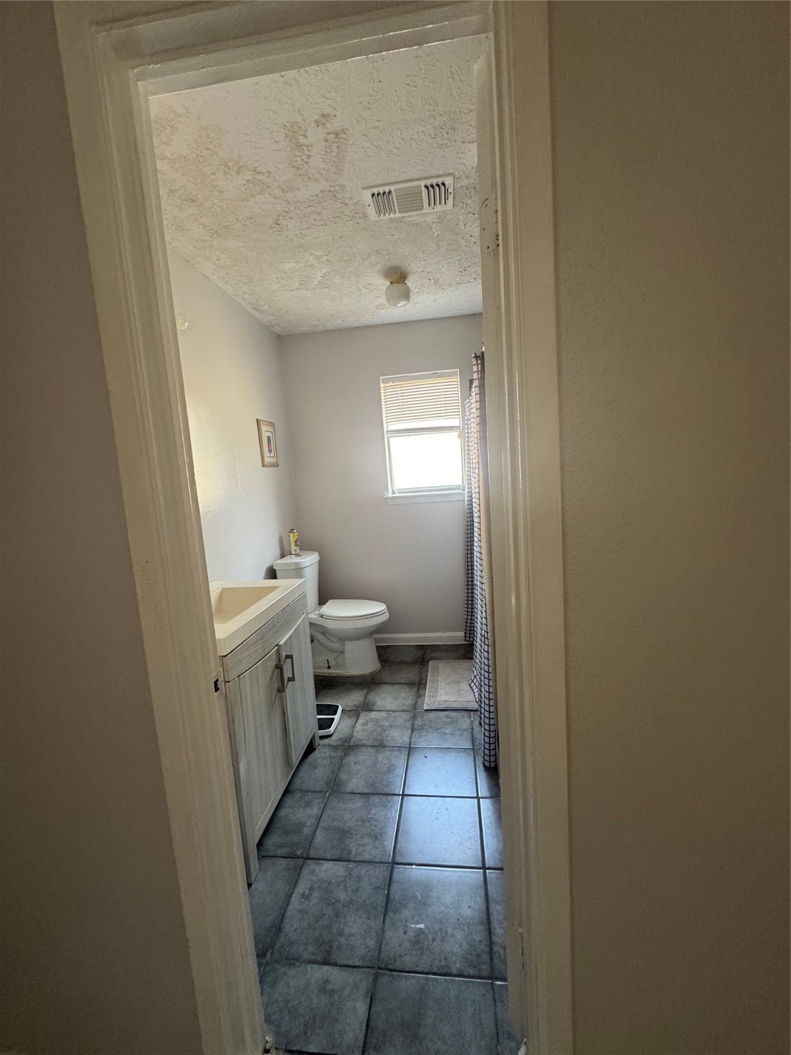 2323 Spring Dusk Drive Spring, TX 77373 - Photo 11 of 19 a bathroom with a sink a toilet and a mirror