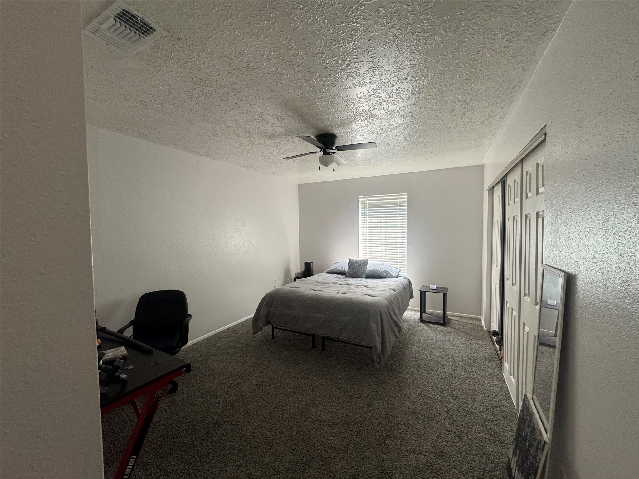 2323 Spring Dusk Drive Spring, TX 77373 - Photo 12 of 19 a bedroom with a bed and a chair