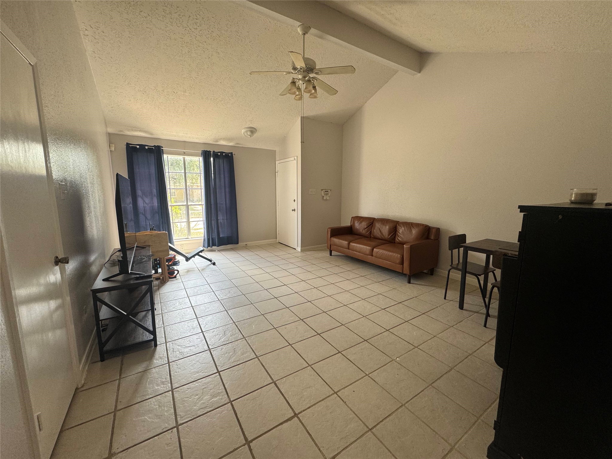 2323 Spring Dusk Drive Spring, TX 77373 - Photo 4 of 19 a living room with furniture a chandelier and a window