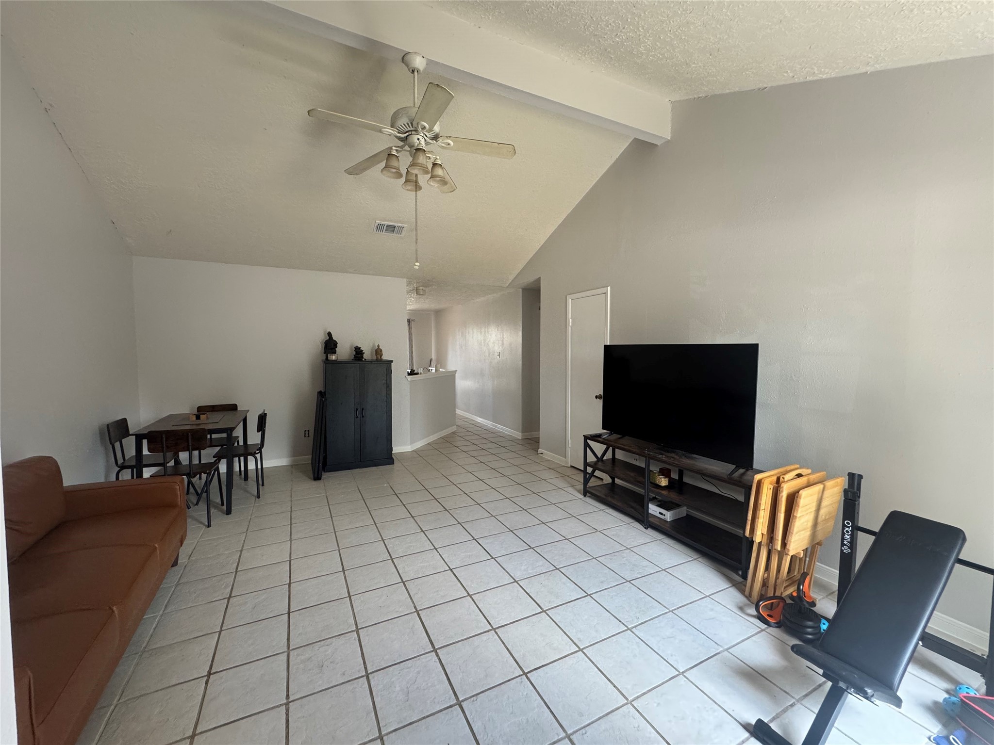 2323 Spring Dusk Drive Spring, TX 77373 - Photo 6 of 19 a view of a livingroom with furniture and a flat screen tv