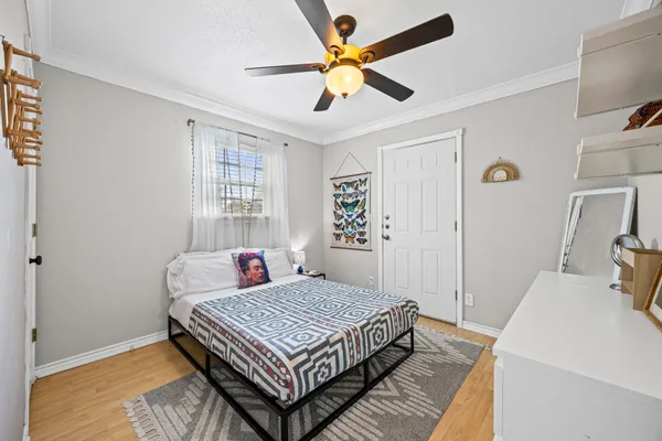 a bedroom that has a bed and a table in it