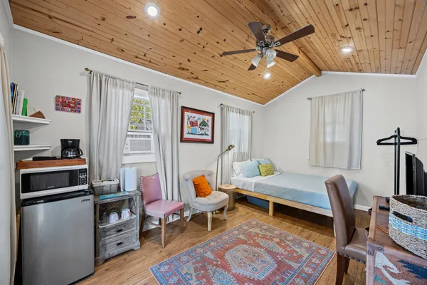 a living room with furniture and a rug