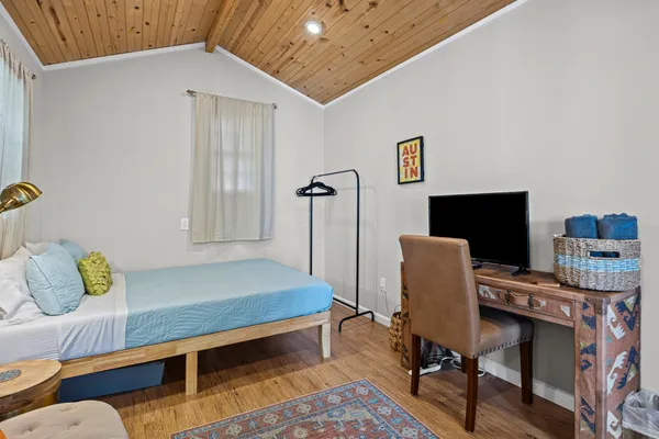 a bedroom with furniture and a bed