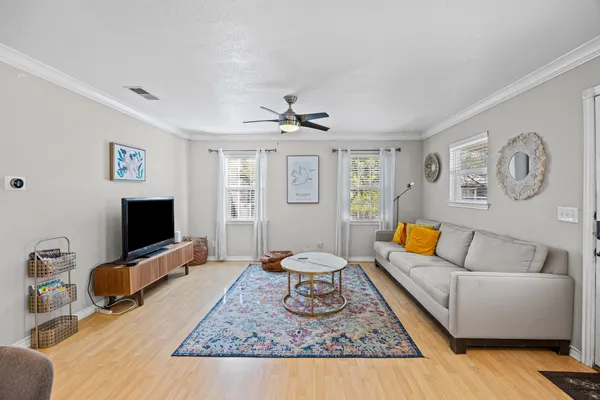 a living room with furniture and a flat screen tv
