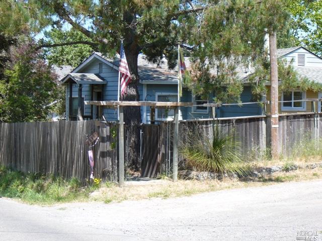 4349 Hessel Road Sebastopol, CA 95472 - Photo 1 of 1 a view of a house with wooden fence next to a road