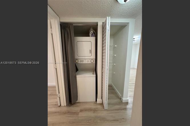 3700 North 56th Avenue, Unit 1012 Hollywood, FL 33021 - Photo 8 of 11 a view of a hallway with wooden floor and a living room