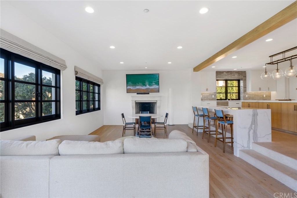 4 Emerald Bay Laguna Beach, CA 92651 - Photo 20 of 75 a living room with furniture large window and table