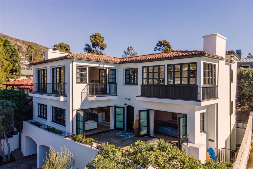 4 Emerald Bay Laguna Beach, CA 92651 - Photo 2 of 75 a front view of a house with a porch