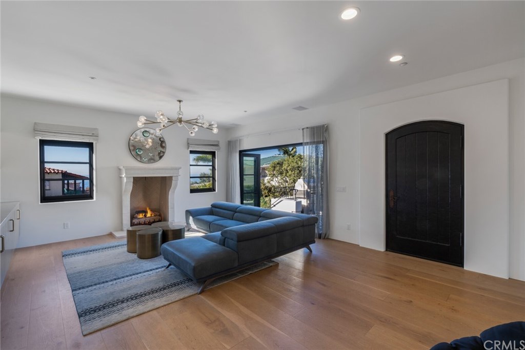 4 Emerald Bay Laguna Beach, CA 92651 - Photo 24 of 75 a living room with furniture and a fireplace