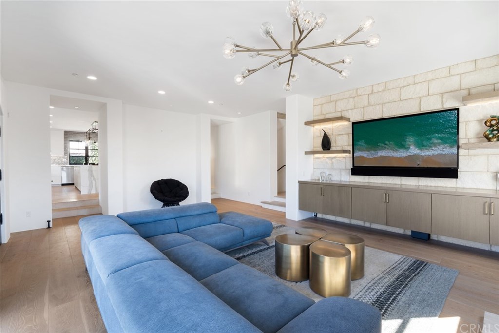 4 Emerald Bay Laguna Beach, CA 92651 - Photo 27 of 75 a living room with furniture and a flat screen tv