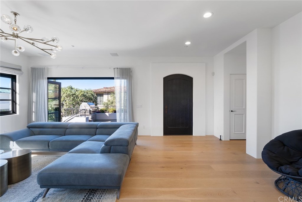 4 Emerald Bay Laguna Beach, CA 92651 - Photo 29 of 75 a living room with furniture and a large window