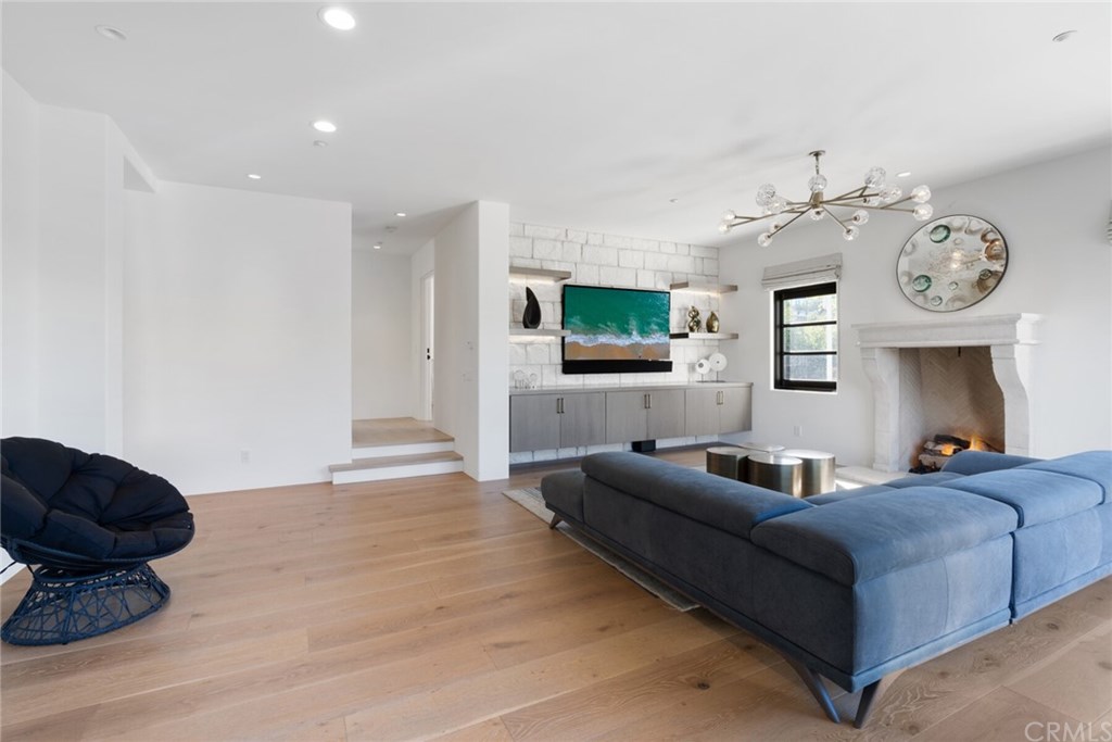 4 Emerald Bay Laguna Beach, CA 92651 - Photo 30 of 75 a living room with furniture a flat screen tv and a wall clock