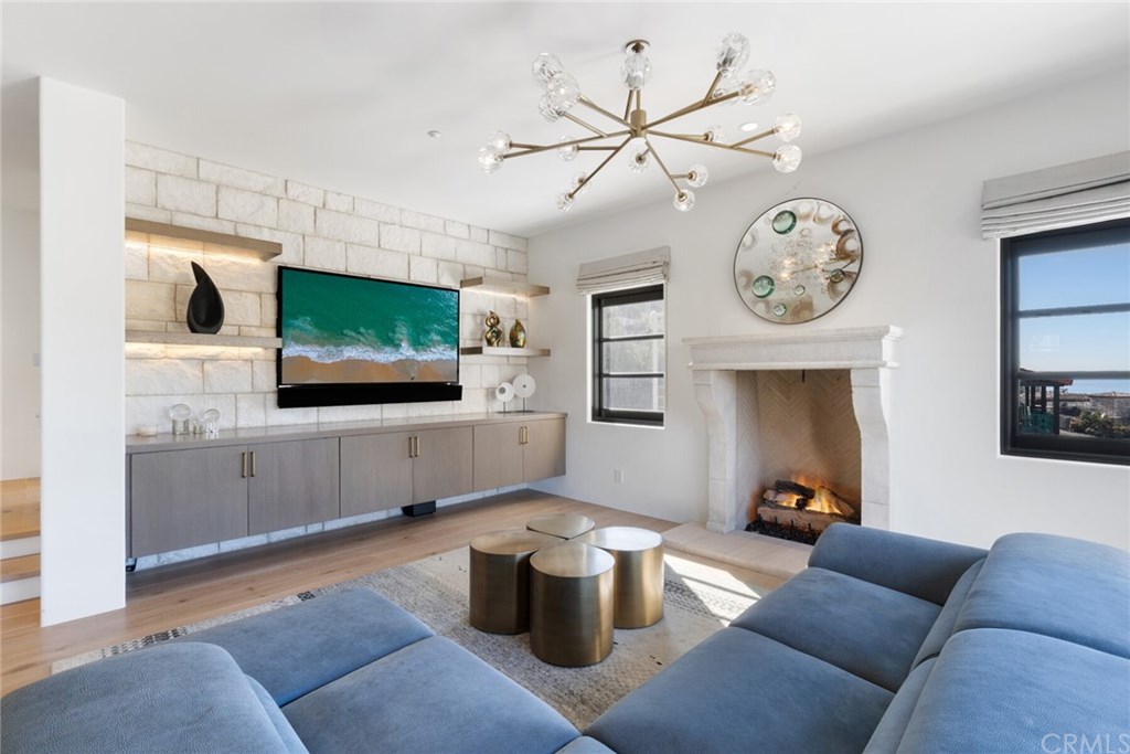 4 Emerald Bay Laguna Beach, CA 92651 - Photo 31 of 75 a living room with furniture and a flat screen tv