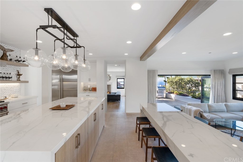 4 Emerald Bay Laguna Beach, CA 92651 - Photo 39 of 75 a living room with furniture and a flat screen tv