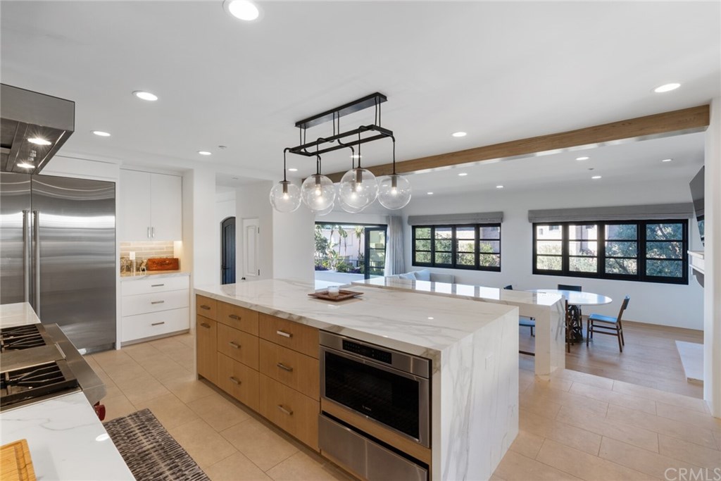 4 Emerald Bay Laguna Beach, CA 92651 - Photo 43 of 75 a large kitchen with a large counter top appliances and cabinets