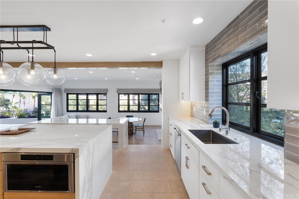4 Emerald Bay Laguna Beach, CA 92651 - Photo 44 of 75 a large white kitchen with a large window