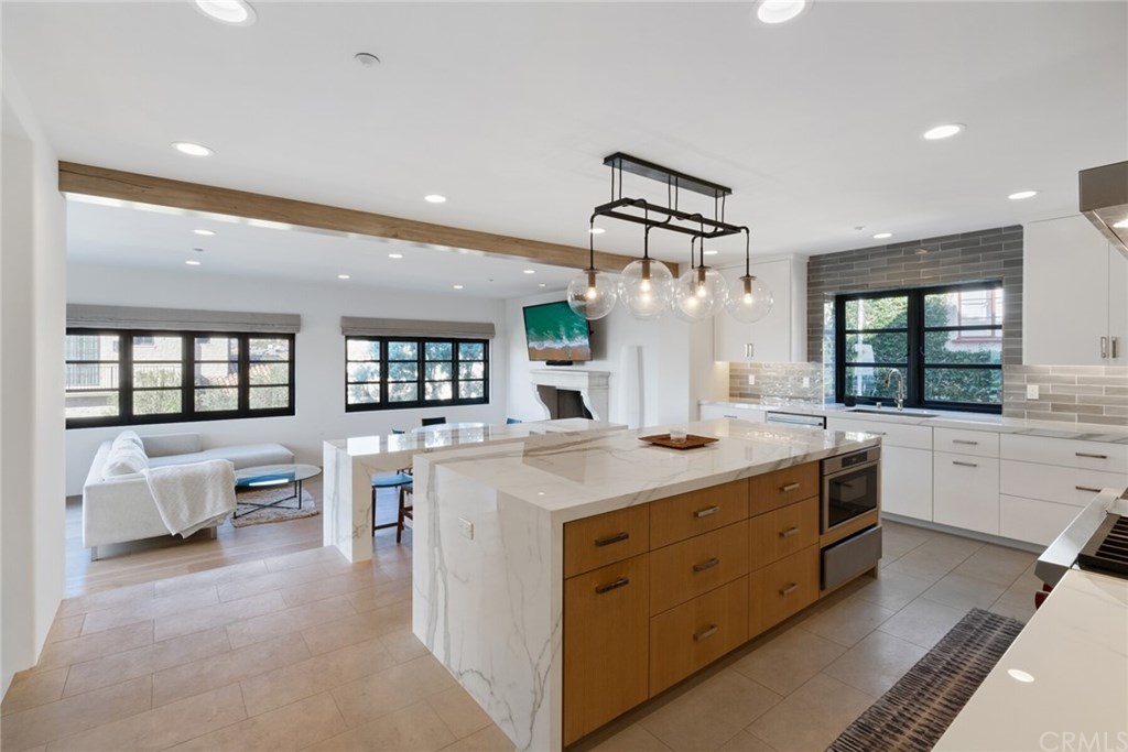 4 Emerald Bay Laguna Beach, CA 92651 - Photo 45 of 75 a kitchen with stainless steel appliances granite countertop a stove and cabinets