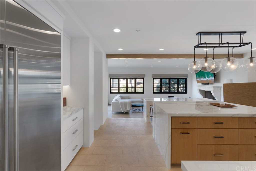 4 Emerald Bay Laguna Beach, CA 92651 - Photo 46 of 75 a bathroom with a granite countertop sink a mirror and shower