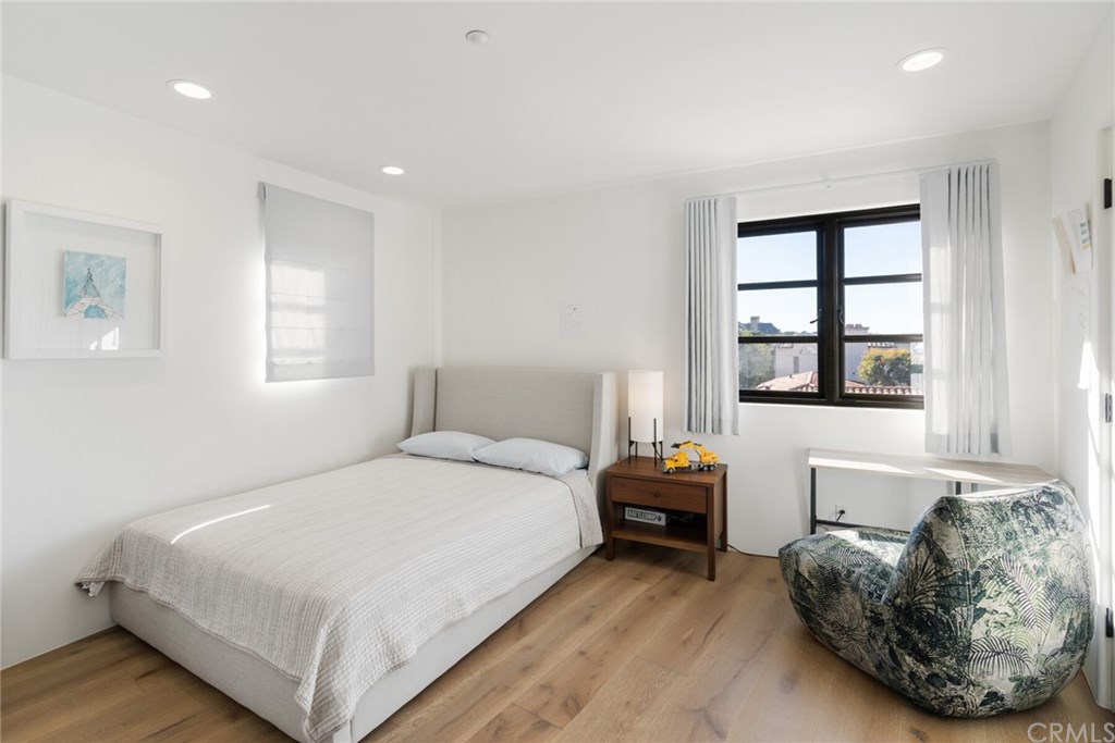 4 Emerald Bay Laguna Beach, CA 92651 - Photo 58 of 75 a bedroom with a bed and window