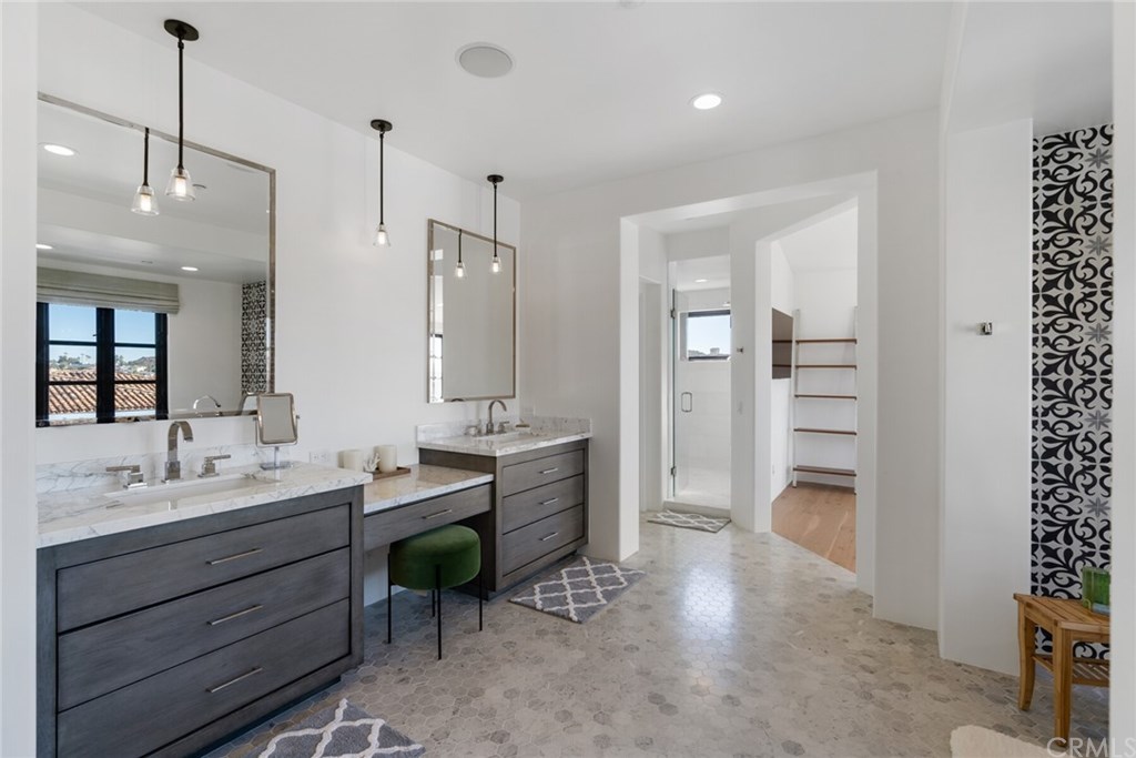 4 Emerald Bay Laguna Beach, CA 92651 - Photo 64 of 75 a spacious bathroom with a granite countertop sink mirror and shower
