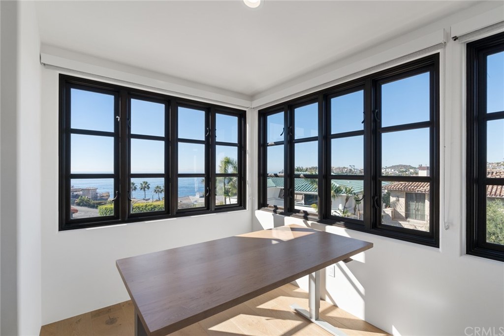 4 Emerald Bay Laguna Beach, CA 92651 - Photo 69 of 75 a view of a living room and a floor to ceiling window and wooden floor