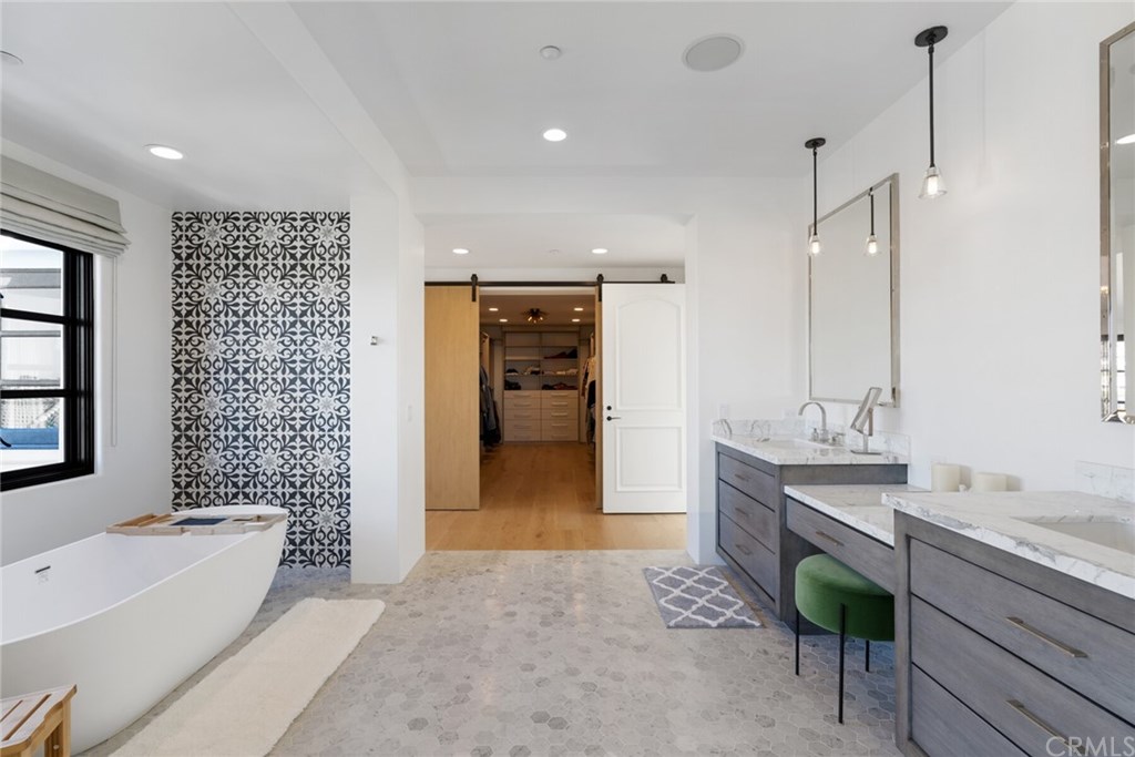 4 Emerald Bay Laguna Beach, CA 92651 - Photo 70 of 75 a spacious bathroom with a granite countertop sink a toilet and bathtub