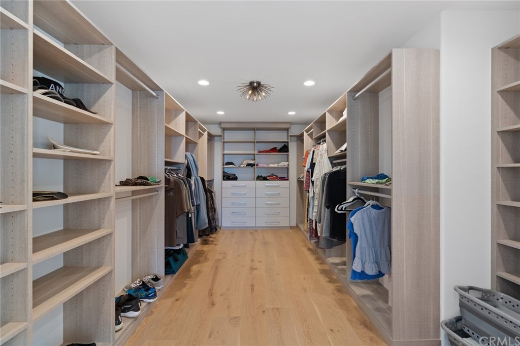 4 Emerald Bay Laguna Beach, CA 92651 - Photo 74 of 75 a view of walk in closet with clothes and shoes
