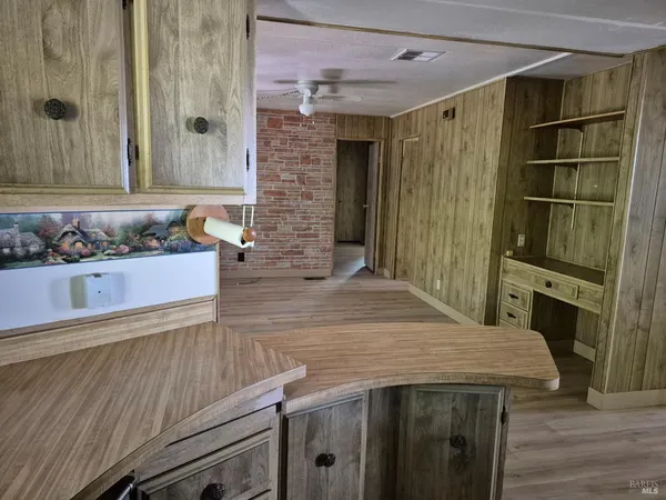 a bathroom with a sink a vanity and a mirror