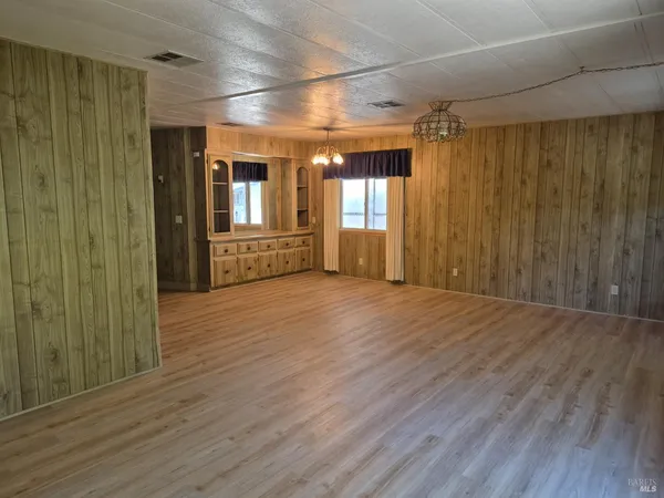 a view of gallery with wooden floor