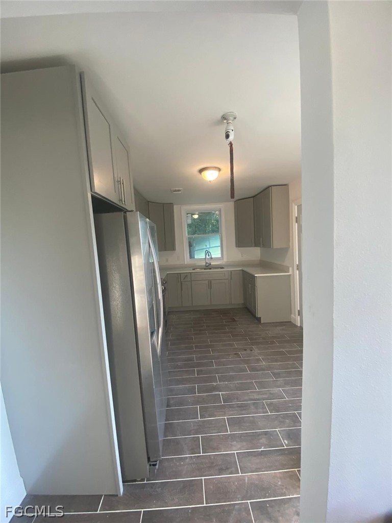 5136 McDonald Road Zellwood, FL 32798 - Photo 13 of 17 a bathroom with a sink and a mirror