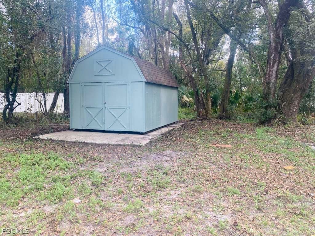 5136 McDonald Road Zellwood, FL 32798 - Photo 16 of 17 a view of a backyard with large trees