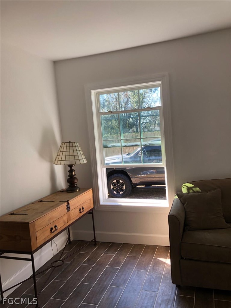 5136 McDonald Road Zellwood, FL 32798 - Photo 6 of 17 a bedroom with furniture and a large window