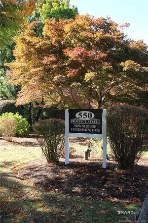 a view of a street sign of a house